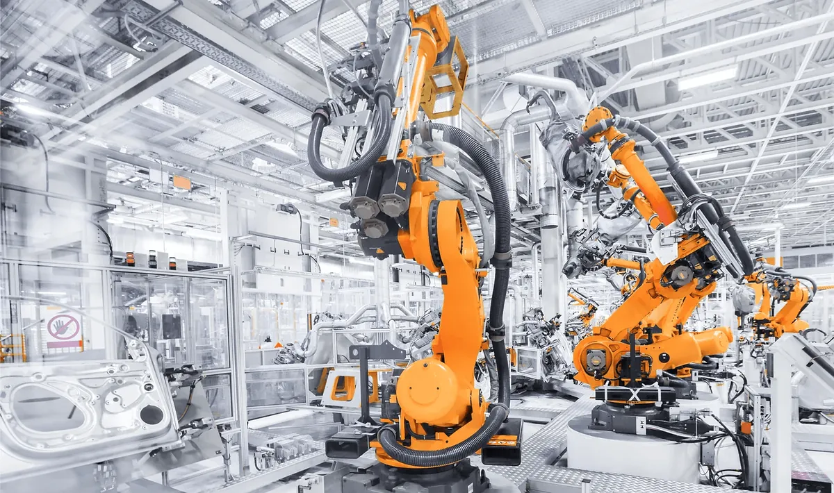 Robotic arms on an automotive manufacturing line